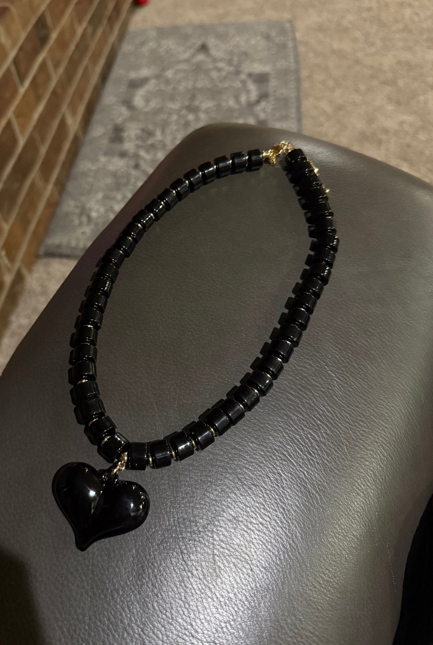 Black and Gold Beaded Necklace with Black Heart
