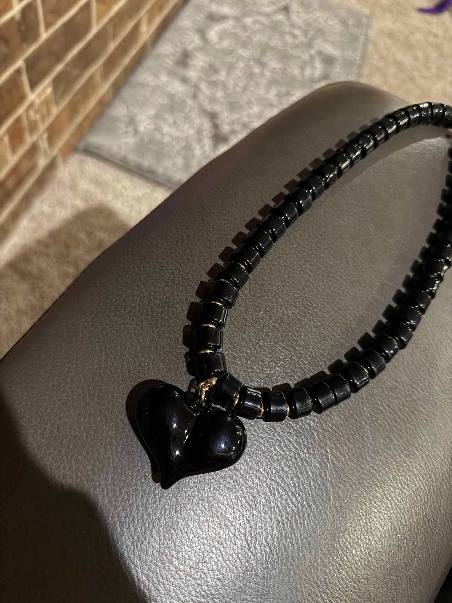 Black and Gold Beaded Necklace with Black Heart